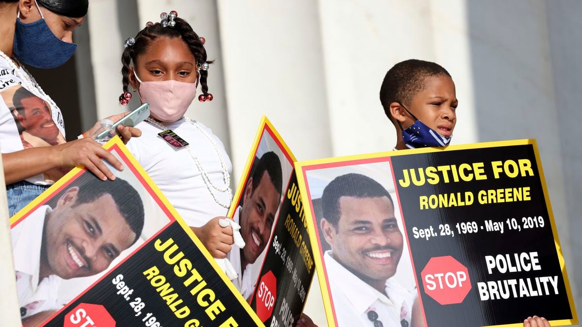 FILE - In this Aug. 28, 2020 file photo, family members of Ronald Greene listen to speakers as demonstrators gather for the March on Washington, in Washington, on the 57th anniversary of the Rev. Martin Luther King Jr.'s "I Have A Dream" speech. Officials told The Associated Press, federal authorities are investigating the death of Greene during what Louisiana State Police described as a struggle to take him into custody following a rural police chase last year. The death of the 49-year-old remains shrouded in secrecy because State Police have declined to release body-camera footage related to the May 2019 chase north of Monroe, La.