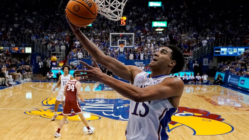 Kansas guard Kevin McCullar Jr. puts up a shot during the first half of an NCAA college...