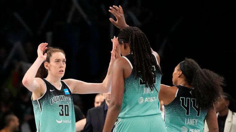 New York Liberty forward Breanna Stewart (30) and forward Jonquel Jones (35) celebrate after...