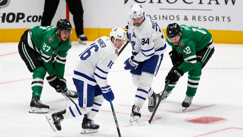 Dallas Stars forwards Mason Marchment (27) and Radek Faksa (12) battle Toronto Maple Leafs...