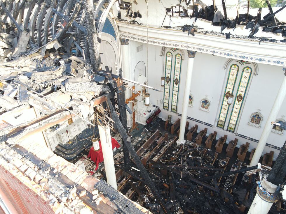 The aftermath of the overnight fire that destroyed a 150-year-old Catholic church in Fort...