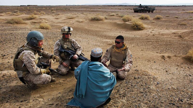 In this Friday, Dec. 11, 2009, file photo, United States Marine Sgt. Isaac Tate, left, and...