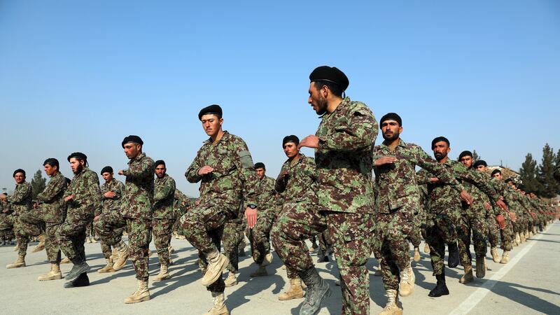 FILE - In this Jan. 18, 2021, file photo newly graduated Afghan National Army march during...