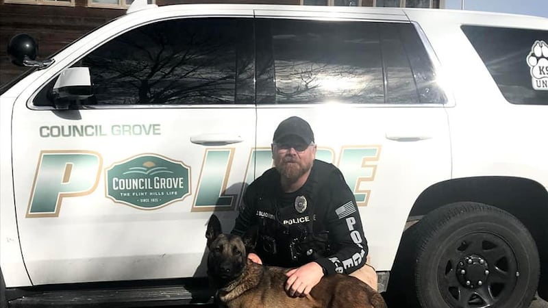 FILE - Council Grove Police Officer Jimmie Blackburn poses with new K9 Abby.