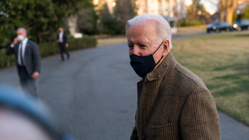 President Joe Biden speaks to the gathered media members upon arrival at the White House in...