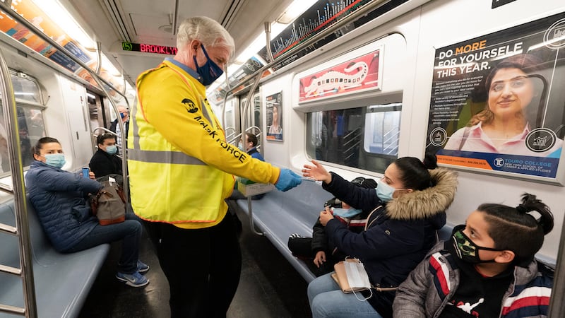 FILE - Patrick Foye, Chairman and CEO of the Metropolitan Transportation Authority, hands out...