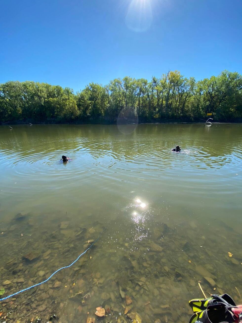Crews pull a vehicle submerged in 16 feet of water from Tuttle Creek on Sept. 25, 2023.