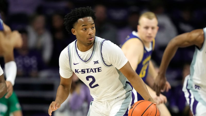 Kansas State guard Tylor Perry drives during the second half of an NCAA college basketball...