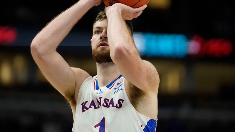 Kansas center Hunter Dickinson takes a free throw during the second half of an NCAA college...
