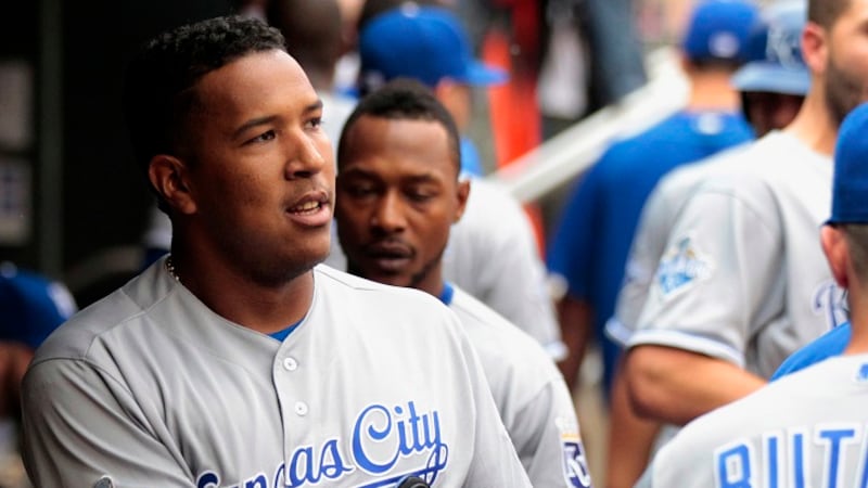 Kansas City Royals Salvador Perez is congratulated in the dugout after hitting a two-run home...