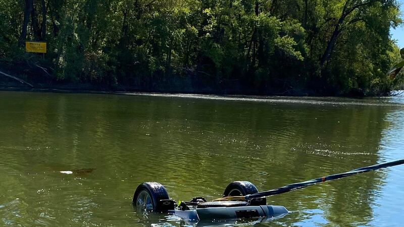 Crews pull a vehicle submerged in 16 feet of water from Tuttle Creek on Sept. 25, 2023.
