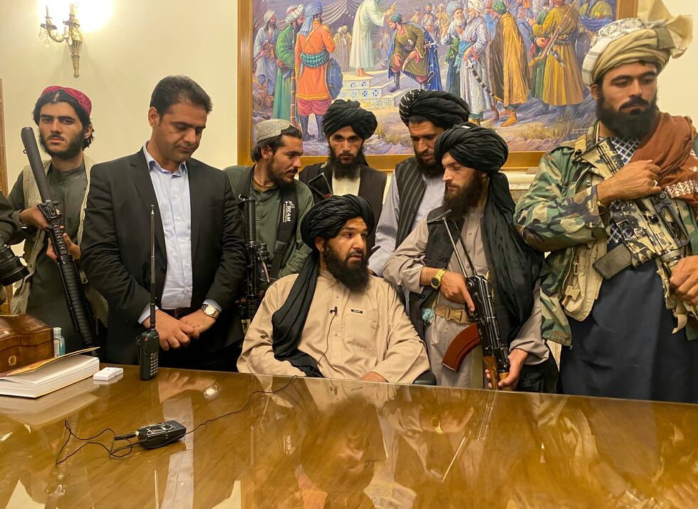 Taliban fighters take control of the presidential palace after the Afghan President Ashraf...