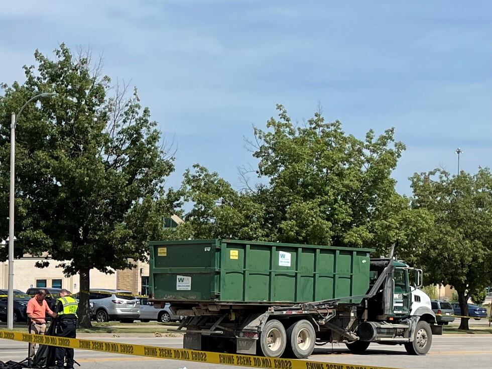 A Waste Management truck remained parked on 4th Street in Downtown Topeka, just feet away from...