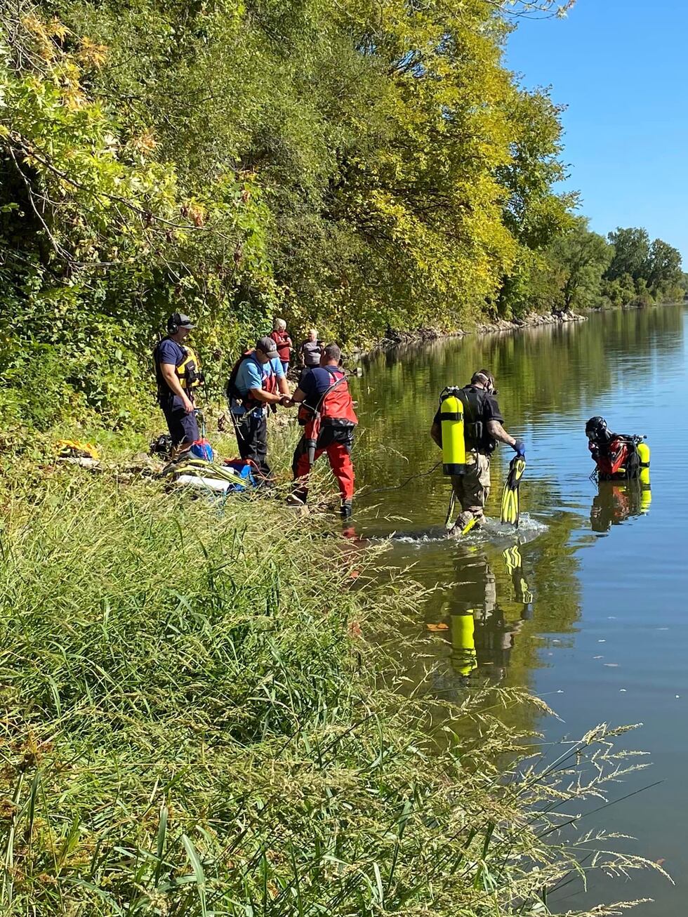 Crews pull a vehicle submerged in 16 feet of water from Tuttle Creek on Sept. 25, 2023.