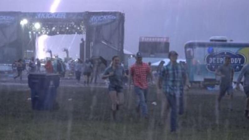 Lightning strikes near backstage at Country Stampede on the final night of the event, on June...