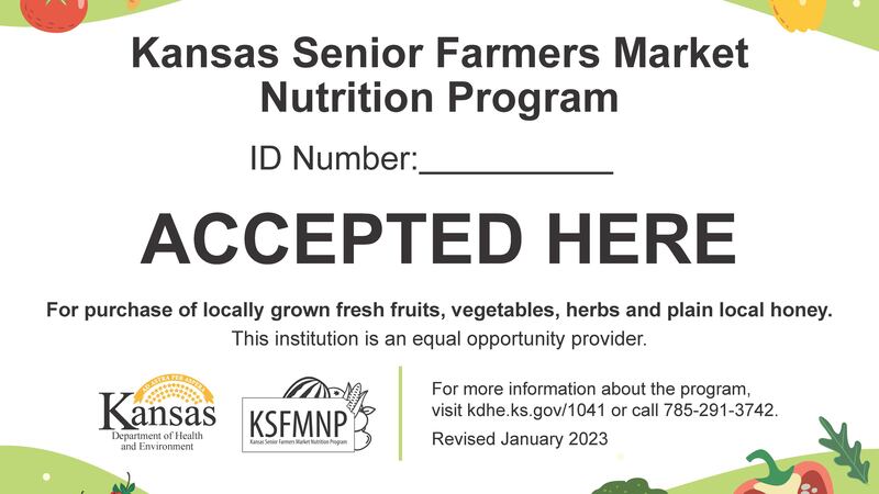 The sign indicates a farmer is authorized to accept the KDHE coupons at local farmers' markets.