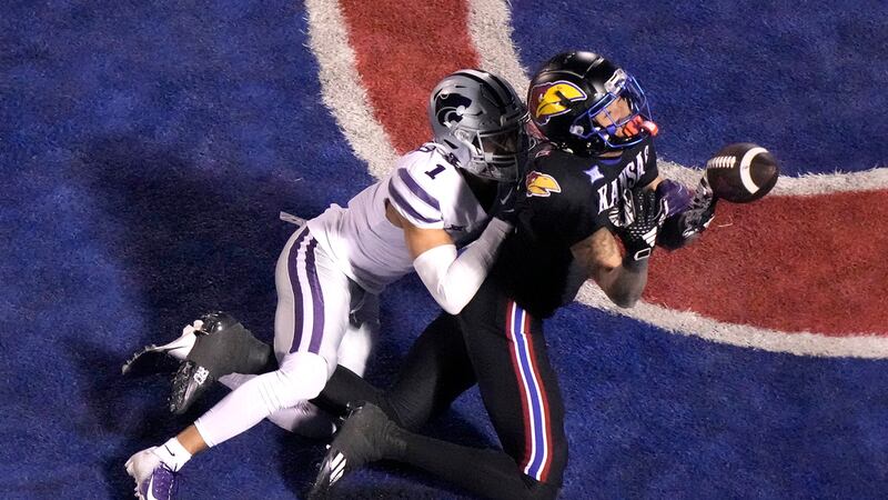 Kansas State cornerback Keenan Garber (1) breaks up a pass intended for Kansas wide receiver...