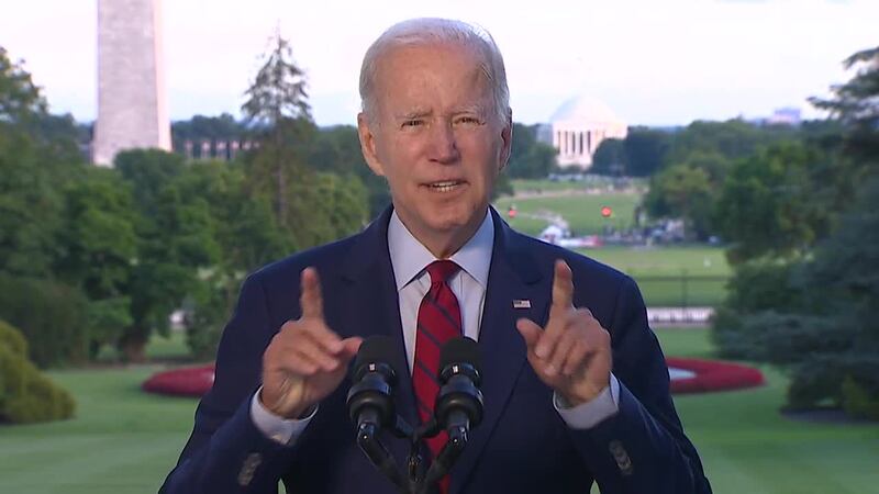 FILE PHOTO - One year after ending the war in Afghanistan, President Joe Biden and top...