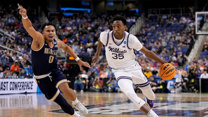 Kansas State forward Nae'Qwan Tomlin drives to the basket past Montana State guard Caleb...