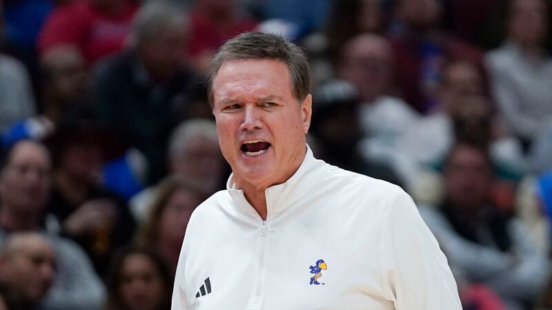 Kansas head coach Bill Self shouts from the sidelines during the first half of an NCAA college...