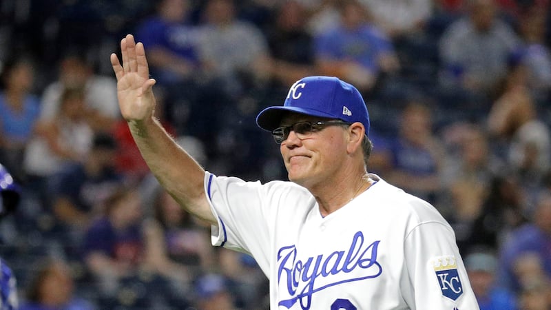 Kansas City Royals manager Ned Yost acknowledges the crowd as he walks to the dugout after...