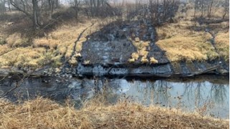 FILE - A pipeline rupture spilled oil into Mill Creek in Washington Co., Kan.