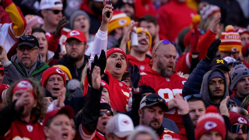 Fans cheer during the second half of the AFC championship NFL football game between the Kansas...