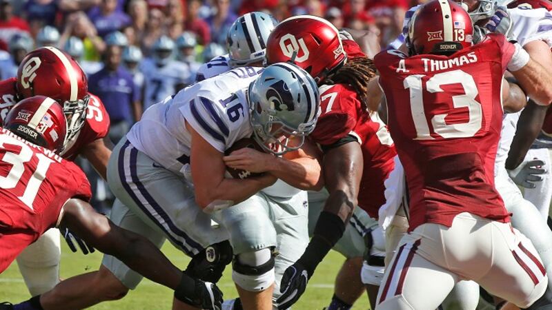 Kansas State quarterback Jesse Ertz (16) pushes through the Oklahoma defense for a touchdown...