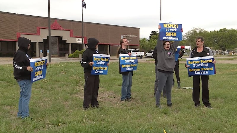 Members of the American Postal Workers Union picketed outside the North Park Post Office on...