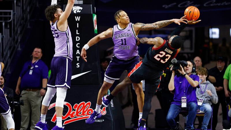 Kansas State forward Keyontae Johnson (11) blocks a shot from Texas Tech guard De'Vion Harmon...