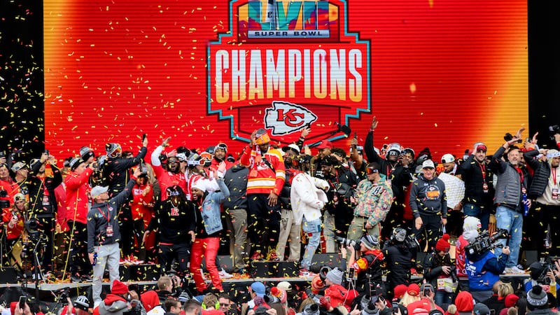 Skyy Moore points to friends in the crowd during the Kansas City Chiefs' victory celebration...