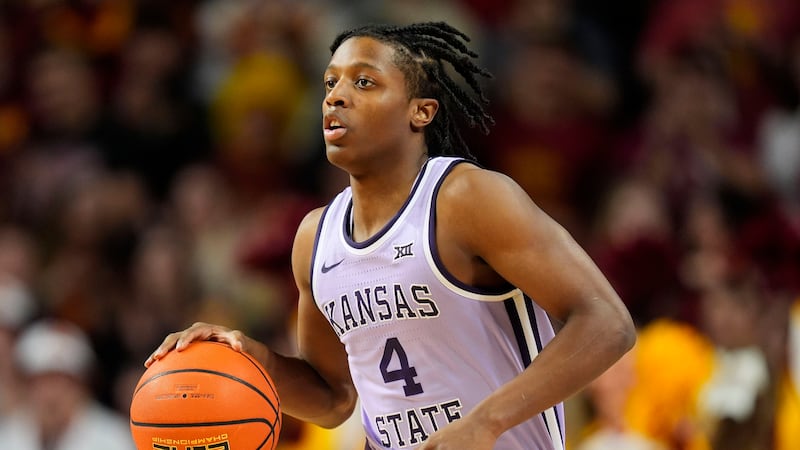 Kansas State guard Dai Dai Ames (4) drives up court during the first half of an NCAA college...